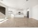 Open concept kitchen boasting white cabinets and granite countertops at 36933 W La Paz St, Maricopa, AZ 85138
