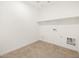 Laundry room with tile flooring and built in shelving at 36933 W La Paz St, Maricopa, AZ 85138