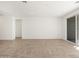 Spacious living area featuring tile floors and access to a patio at 36933 W La Paz St, Maricopa, AZ 85138