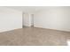 Bright living room with tile floors and sliding glass door leading to backyard at 36933 W La Paz St, Maricopa, AZ 85138