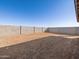 Large backyard enclosed by a block wall, offering privacy and space at 36944 W Prado St, Maricopa, AZ 85138