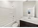 Well-lit bathroom with a shower-tub combo and modern vanity at 36944 W Prado St, Maricopa, AZ 85138