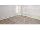 This bedroom is carpeted and has a view of the closet and doorway at 36944 W Prado St, Maricopa, AZ 85138