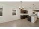 Eat-in kitchen with dark wood cabinets, granite countertops and stainless steel appliances at 36944 W Prado St, Maricopa, AZ 85138