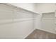 Walk-in closet with carpet and clothes rod at 36944 W Prado St, Maricopa, AZ 85138