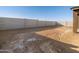 Large backyard with block wall and sandy area at 36973 W La Paz St, Maricopa, AZ 85138