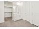 Bathroom featuring vanity, walk-in closet, and tiled floor at 36973 W La Paz St, Maricopa, AZ 85138