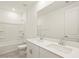 Bathroom boasts double vanity and shower/tub combo at 36973 W La Paz St, Maricopa, AZ 85138