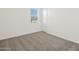 Simple bedroom with neutral carpeting at 36973 W La Paz St, Maricopa, AZ 85138