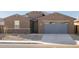 Single-story home with a two-car garage at 36973 W La Paz St, Maricopa, AZ 85138