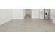 Long hallway leading to bedrooms and kitchen area at 36973 W La Paz St, Maricopa, AZ 85138
