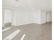 Spacious living room with tile flooring and access to bedroom at 36973 W La Paz St, Maricopa, AZ 85138