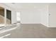 Open living space featuring tile floors and large windows at 36973 W La Paz St, Maricopa, AZ 85138