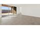 Bright and spacious living area with sliding glass doors leading to the backyard at 36973 W La Paz St, Maricopa, AZ 85138
