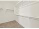 Spacious walk-in closet with ample shelving and hanging rods at 36973 W La Paz St, Maricopa, AZ 85138