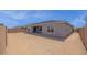 Spacious backyard with a covered patio, providing ample space for outdoor activities at 17134 W Hackamore Dr, Surprise, AZ 85387