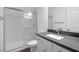 Modern bathroom with a sleek glass shower enclosure and contemporary fixtures creating a spa-like retreat at 17134 W Hackamore Dr, Surprise, AZ 85387