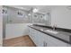 Modern bathroom featuring double sinks, sleek countertops, and a spacious walk-in shower with tile surround at 17134 W Hackamore Dr, Surprise, AZ 85387