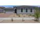 Charming single-story home featuring a two-car garage and low maintenance desert landscaping at 17134 W Hackamore Dr, Surprise, AZ 85387