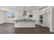 Bright kitchen with white cabinets, stainless steel appliances, and sleek black countertops at 17134 W Hackamore Dr, Surprise, AZ 85387