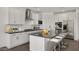 Eat-in kitchen featuring sleek countertops, stainless steel appliances, and island with bar seating at 17134 W Hackamore Dr, Surprise, AZ 85387