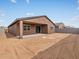 Spacious backyard with a covered patio and potential for landscaping at 4323 W Josephine St, San Tan Valley, AZ 85144