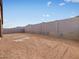 Empty backyard enclosed by a tall block wall offering privacy at 4323 W Josephine St, San Tan Valley, AZ 85144