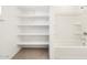 Functional bathroom with tub/shower combo and built-in shelving at 4323 W Josephine St, San Tan Valley, AZ 85144
