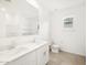 Bright bathroom featuring double sinks, large mirror, and tile flooring at 4323 W Josephine St, San Tan Valley, AZ 85144