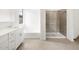 Bright bathroom featuring a double sink vanity, shower, and separate soaking tub for relaxation at 4323 W Josephine St, San Tan Valley, AZ 85144