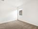 Bright bedroom featuring carpet, window, and white walls at 4323 W Josephine St, San Tan Valley, AZ 85144