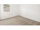 Clean, carpeted bedroom with a bright window providing natural light at 4323 W Josephine St, San Tan Valley, AZ 85144