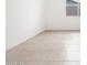 Bright, airy bedroom with neutral tile flooring and natural light from the window at 4323 W Josephine St, San Tan Valley, AZ 85144