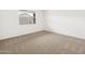 Empty bedroom with neutral carpet, a window, and white walls at 4323 W Josephine St, San Tan Valley, AZ 85144