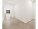 Bright hallway featuring tile flooring, leading to living spaces with natural light at 4323 W Josephine St, San Tan Valley, AZ 85144