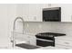 Detailed shot of a modern kitchen featuring stainless steel appliances and sleek countertops at 4323 W Josephine St, San Tan Valley, AZ 85144