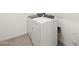 Laundry room with a new white washing machine and dryer at 4323 W Josephine St, San Tan Valley, AZ 85144