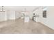 Spacious living space with an open-concept kitchen featuring a central island and stainless steel appliances at 4323 W Josephine St, San Tan Valley, AZ 85144