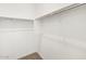 Walk-in closet with white walls, neutral carpet, and closet rods at 4323 W Josephine St, San Tan Valley, AZ 85144