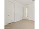 Bedroom featuring neutral carpeting, white walls, and a closed closet at 4919 W Hunter Trl, San Tan Valley, AZ 85144