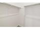 Walk-in closet with white walls, carpeted floor, and metal rods for hanging clothes at 4919 W Hunter Trl, San Tan Valley, AZ 85144