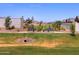 Park benches with well-maintained landscaping and a drainage culvert offers a comfortable place to relax at 4919 W Hunter Trl, San Tan Valley, AZ 85144