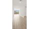 Bright hallway featuring tile flooring, recessed lighting, and sliding glass doors leading to an outdoor area at 4919 W Hunter Trl, San Tan Valley, AZ 85144
