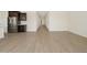 Spacious living room showcasing beautiful flooring and abundant natural light at 4919 W Hunter Trl, San Tan Valley, AZ 85144