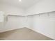 Spacious walk-in closet with shelving and ample storage space for organizing clothes and accessories at 4919 W Hunter Trl, San Tan Valley, AZ 85144