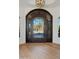 Elegant entryway with arched doorway and hardwood floors at 10801 E Happy Valley Rd # 27, Scottsdale, AZ 85255