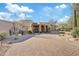 Luxury home with a stone facade and desert landscaping at 10801 E Happy Valley Rd # 27, Scottsdale, AZ 85255