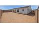 A roomy backyard with privacy walls, offering a blank canvas for landscaping and outdoor activities at 25137 N 171St Ave, Surprise, AZ 85387