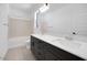 Bright bathroom featuring a dual sink vanity, bathtub, and modern fixtures at 25137 N 171St Ave, Surprise, AZ 85387