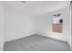 Neutral bedroom featuring soft carpeting, a window and ample natural light at 25137 N 171St Ave, Surprise, AZ 85387